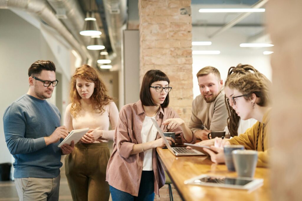 Team collaborating in modern office workspace.