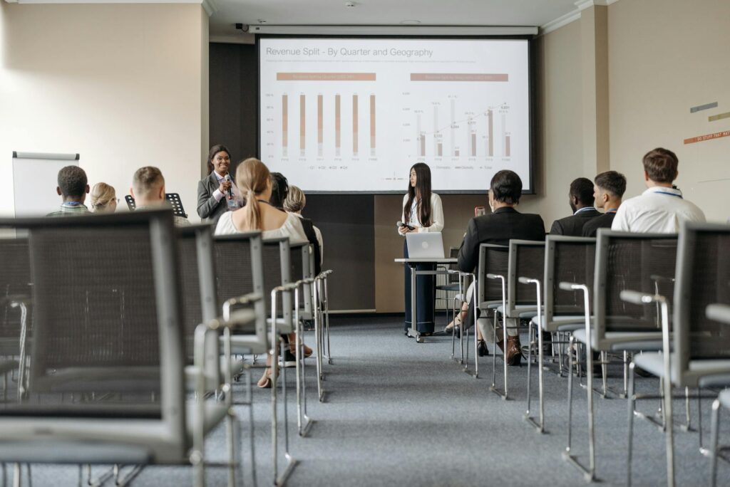 Business presentation on revenue analysis in conference room.