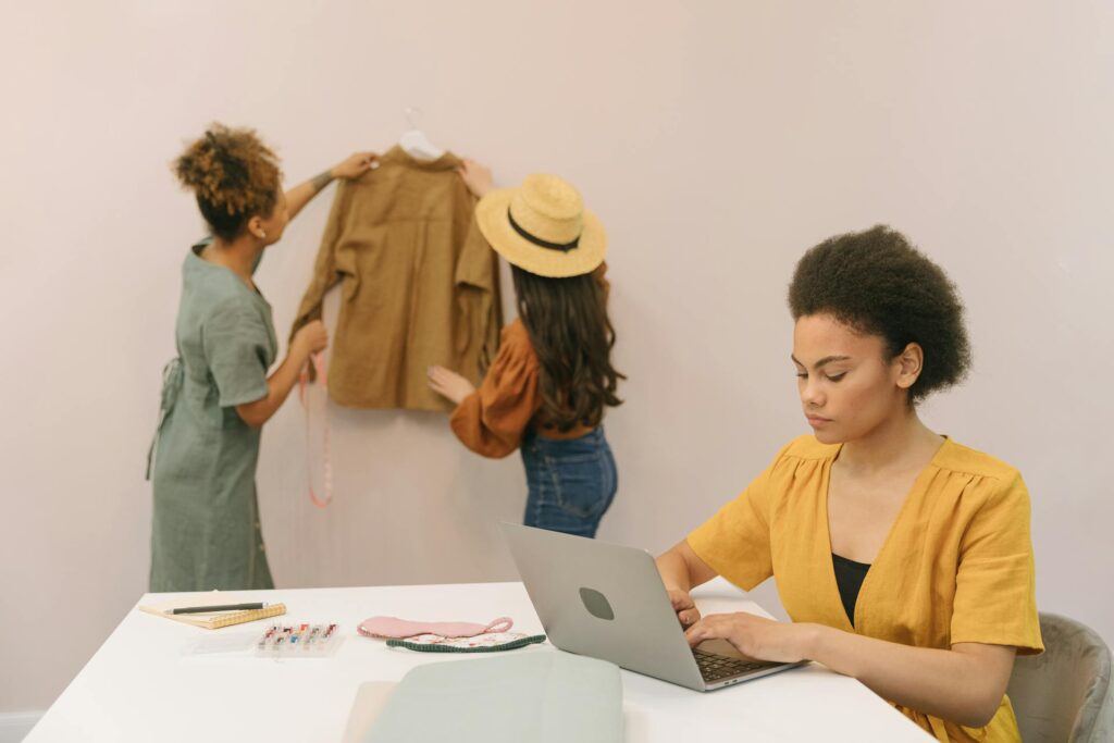Women working in fashion design studio